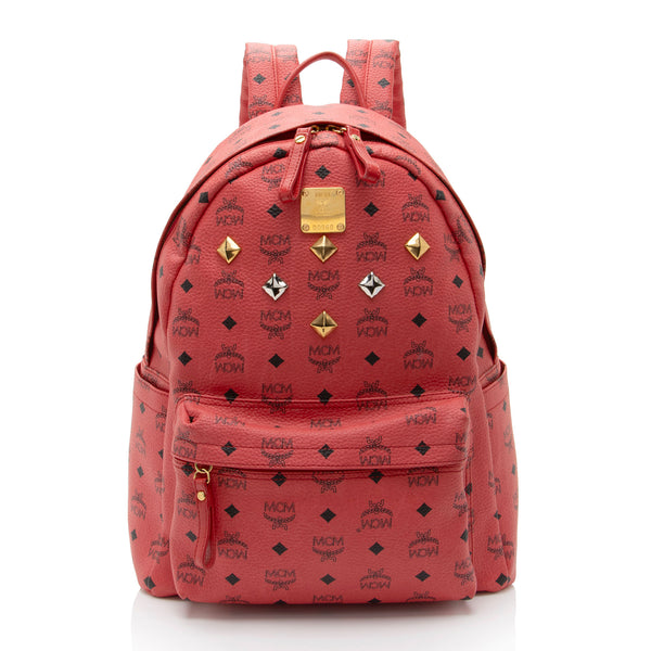 red mcm backpack with studs